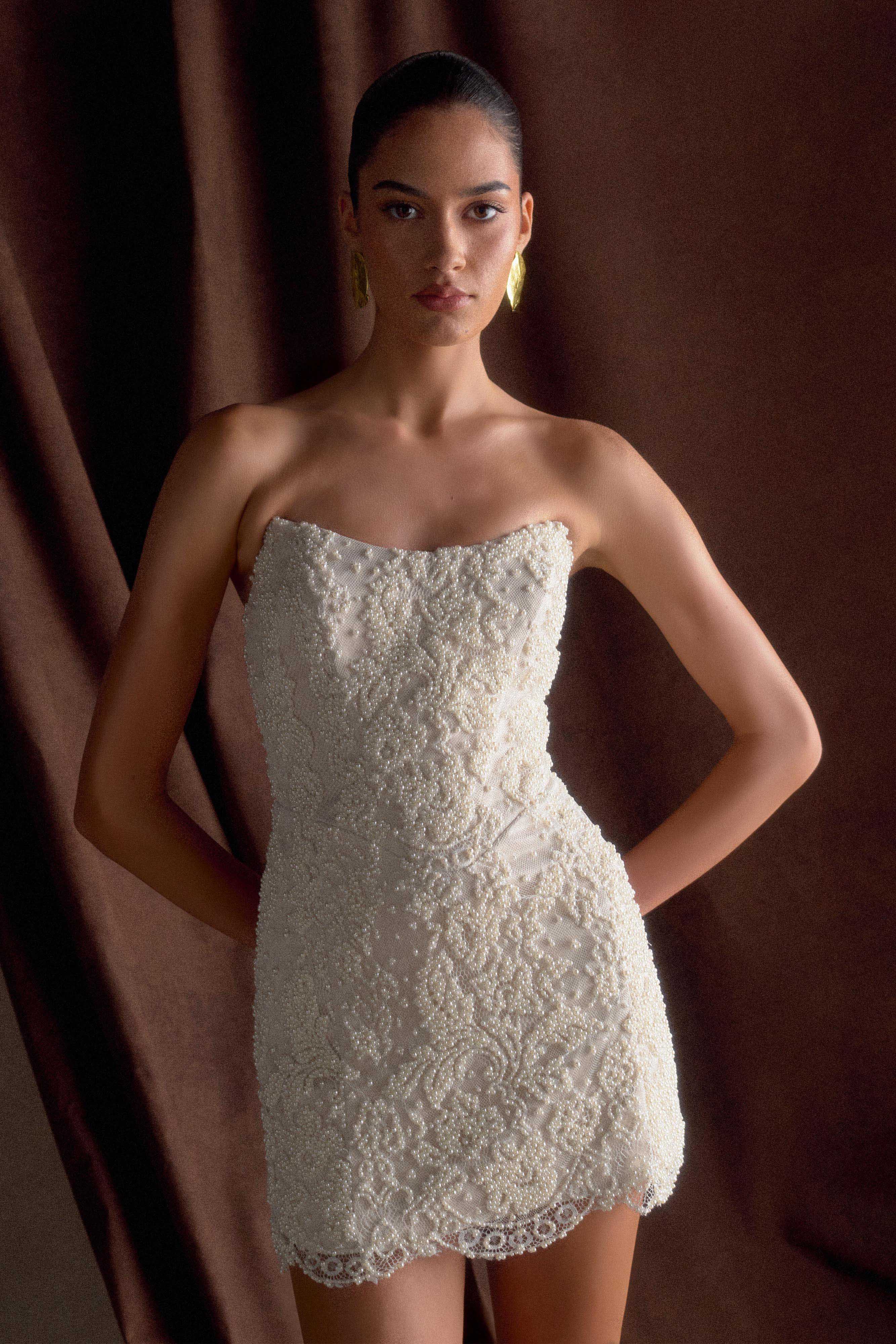 beaded white mini dress Theia Amanda keeping them out of vulnerable situations and giving them the dignity of fair work Bound Hearts Beaded Mini Dress