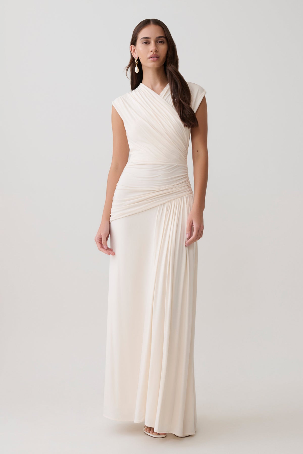 Woman wearing white cross over modal maxi dress.
