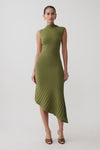 Woman wearing a green pleated knit dress.