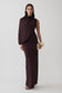 Woman wearing brown gather sleeve maxi dress.