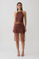 Woman wearing a brown sheer halter midi dress.