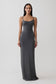 Woman wearing a grey peached jersey maxi dress.