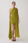 Woman wearing a green mini dress.