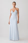 Woman wearing a light blue halter neck maxi dress.