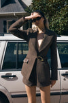 Image of woman in brown tweed blazer