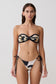 Woman wearing a floral black and white patterned bikini set.