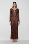 Woman wearing a brown lurex crochet maxi dress.