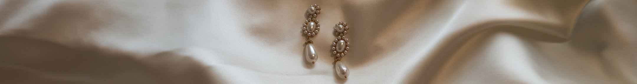 Image of pearl earrings.