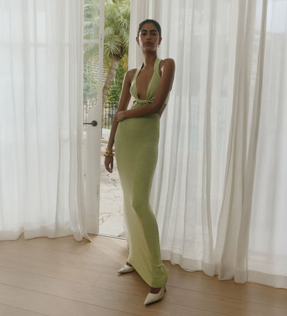 Woman wearing an olive green knit dress