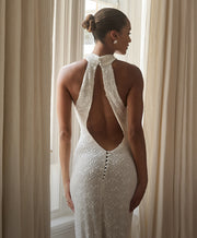 Image of woman in backless bridal gown.