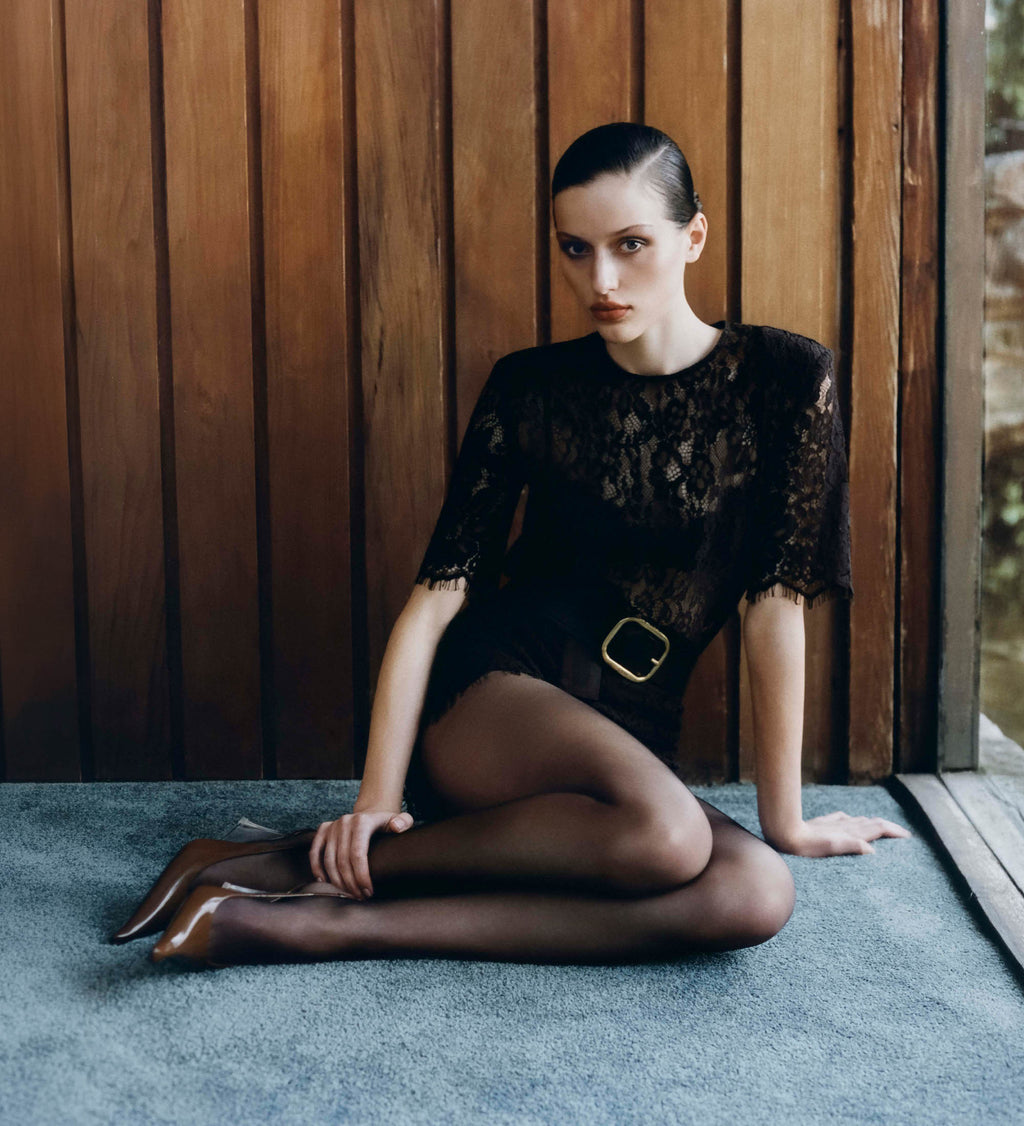 Image of woman in brown lace top.
