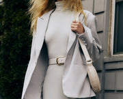 Image of woman in ice grey suiting.