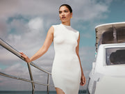 Image of woman in white maxi dress.