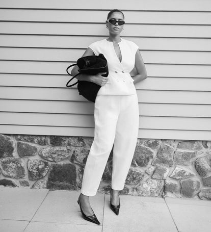 Image of woman wearing white suiting vest with matching pants