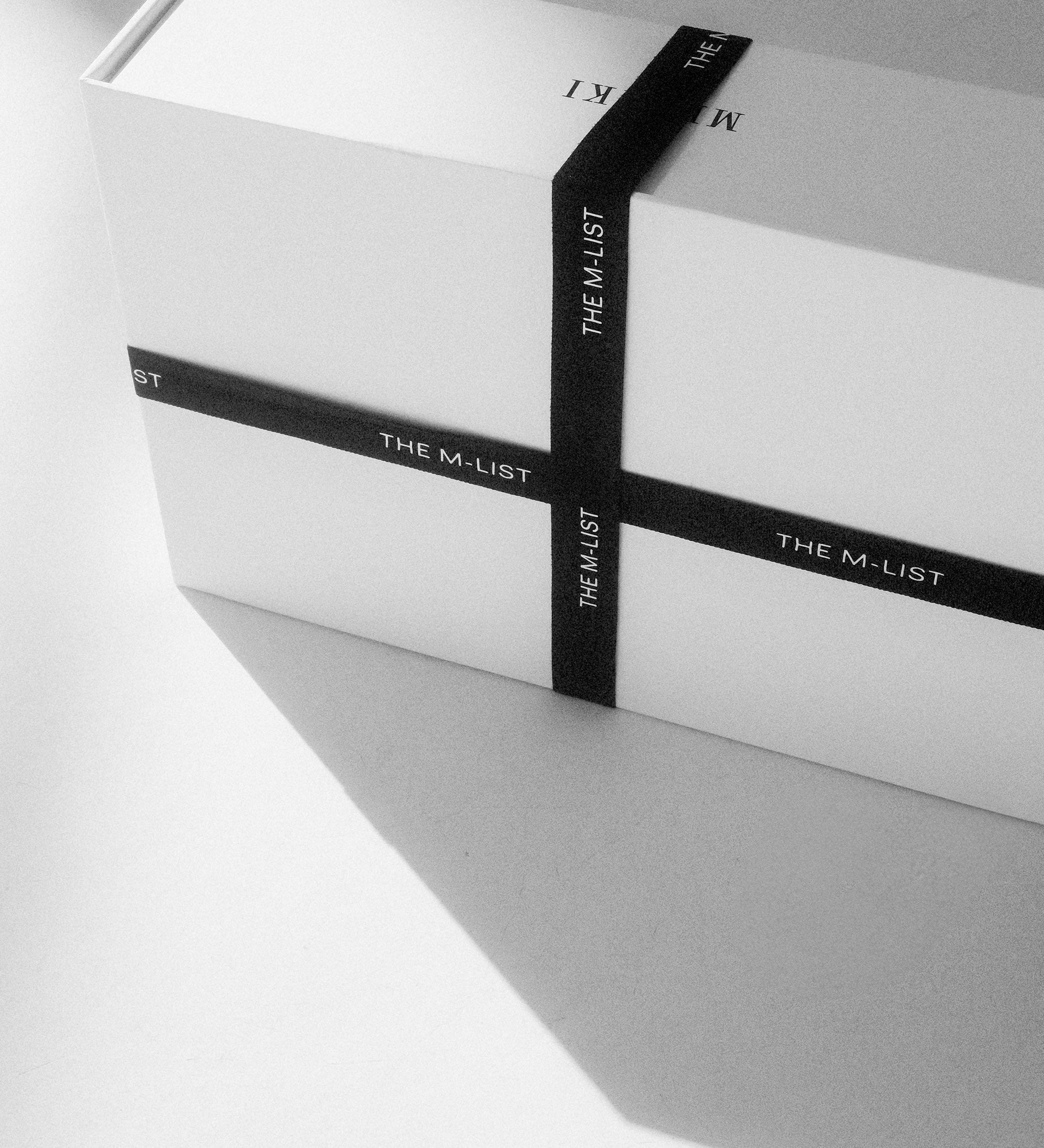 White box with black 'The M-List' branding on a white background.