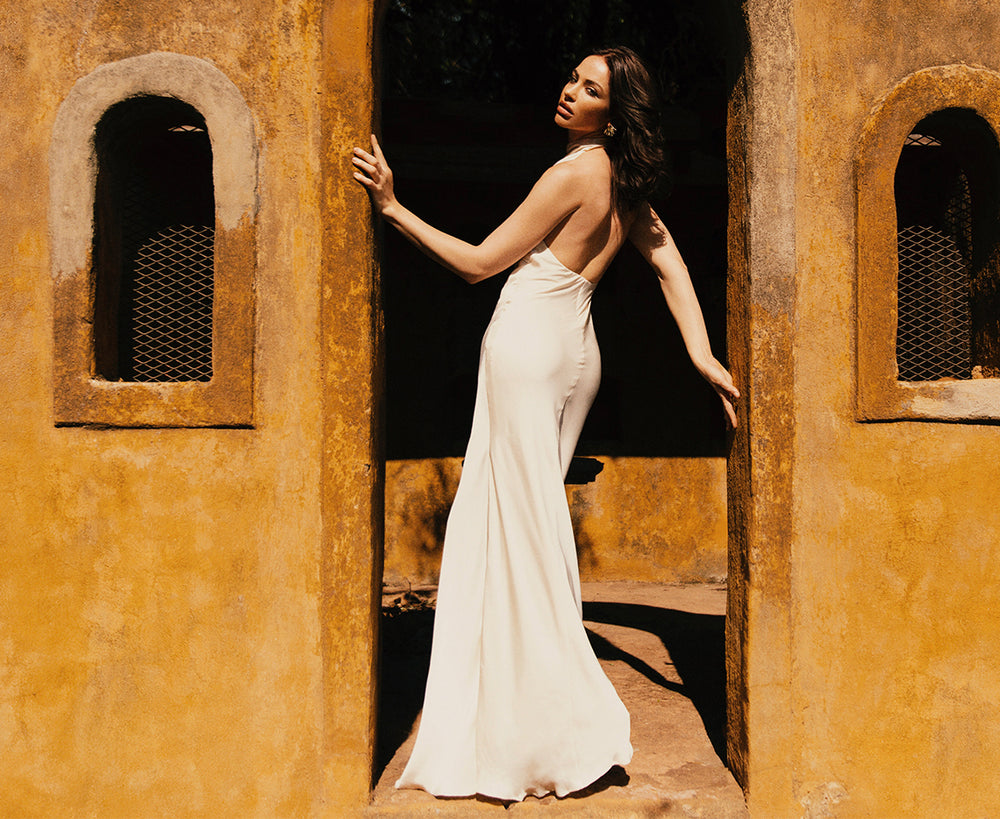 Image of woman in white maxi dress.